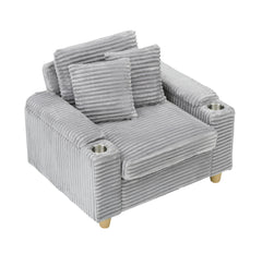 Grey corduroy single sofa with one pillow, two throw pillows, a footstool and two storage Spaces.