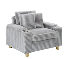 Grey corduroy single sofa with one pillow, two throw pillows, a footstool and two storage Spaces.