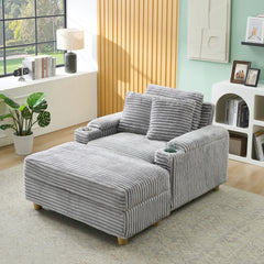 Grey corduroy single sofa with one pillow, two throw pillows, a footstool and two storage Spaces.