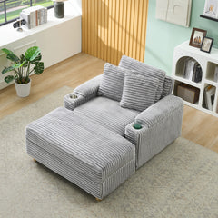 Grey corduroy single sofa with one pillow, two throw pillows, a footstool and two storage Spaces.